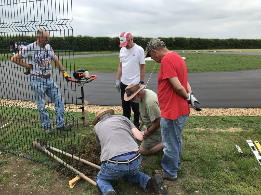 Volunteers working on the security fence